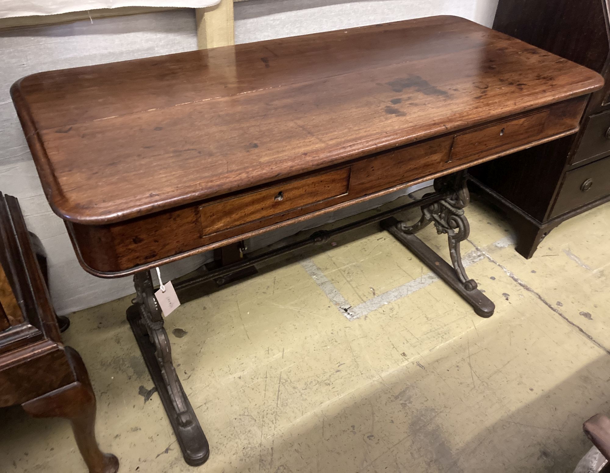 A Victorian mahogany side table with cast iron underframe, width 130cm, depth 60cm, height 80cm